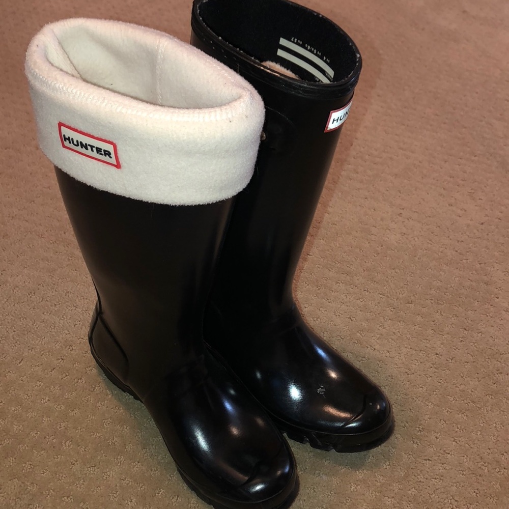 Black tall hunter boots